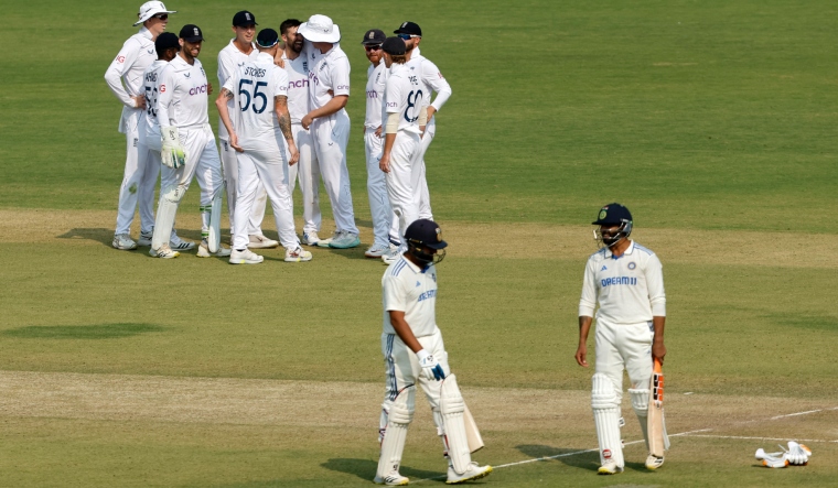 england-s-mark-wood-celebrates-with-teammates-after-taking-the-wicket-of-india-s-rohit-sharma