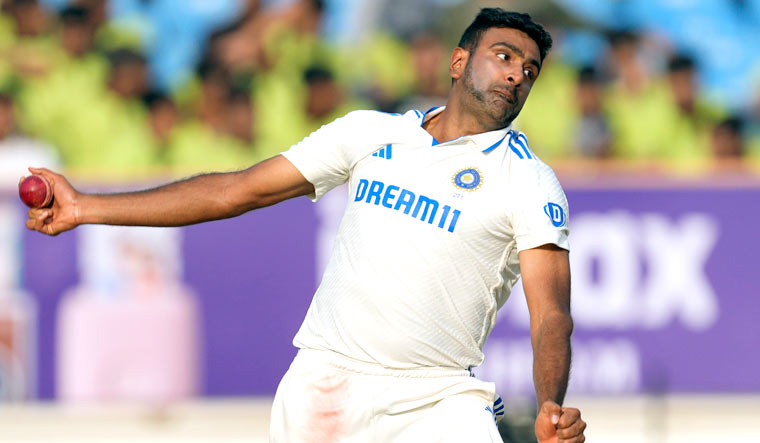 Ravichandran Ashwin bowls on the second day of the third Test match between England and India in Rajkot