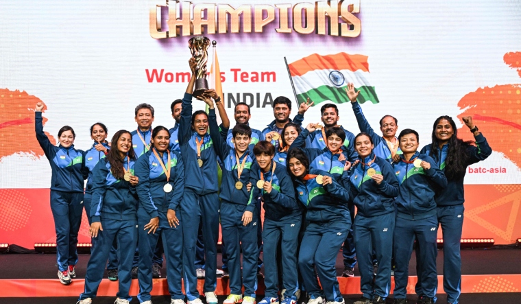india-women-celebrate-with-the-trophy-after-winning-against-thailand-at-the-2024-badminton-asia-team-championships-afp