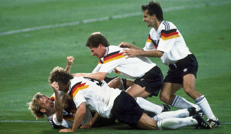 (File) Germany players celebrate after Andreas Brehme (left on ground) scored the winning goal in the World Cup final against Argentina, in the Olympic Stadium, in Rome, on July 8, 1990 | AP