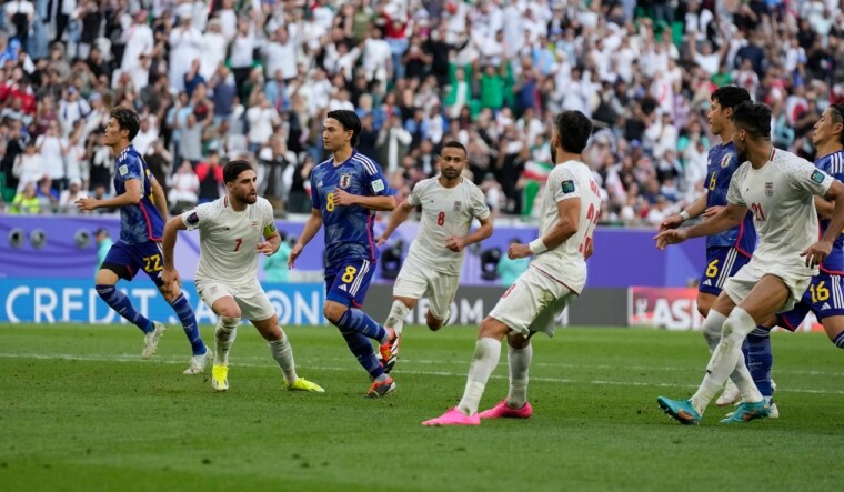 Iran's Alireza Jahanbakhsh (second left) celebrates after scoring a goal through a penalty kick during the Asian Cup quarterfinal against Japan | AP