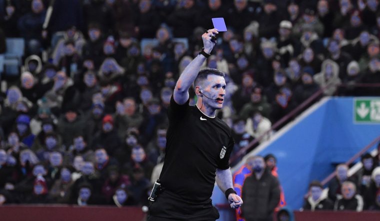 Football referees set to carry blue cards to discipline players