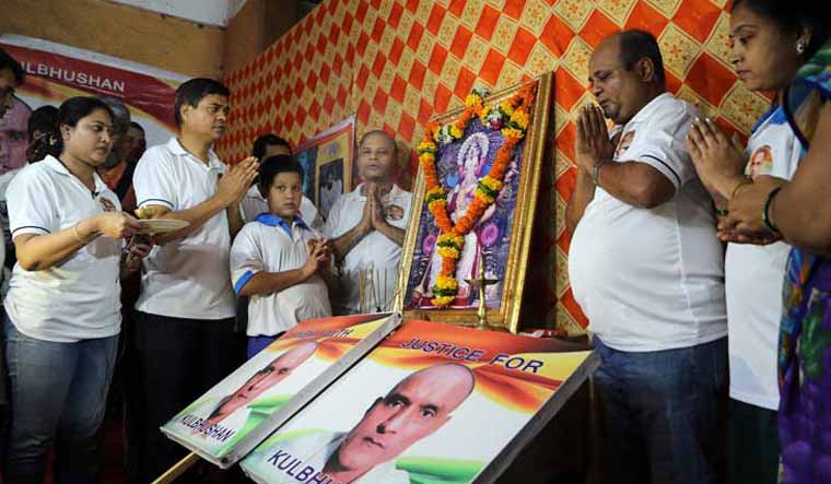 Friends of Kulbhushan Jadhav in Mumbai pray for his release ahead of the verdict of the International Court of Justice | AP 