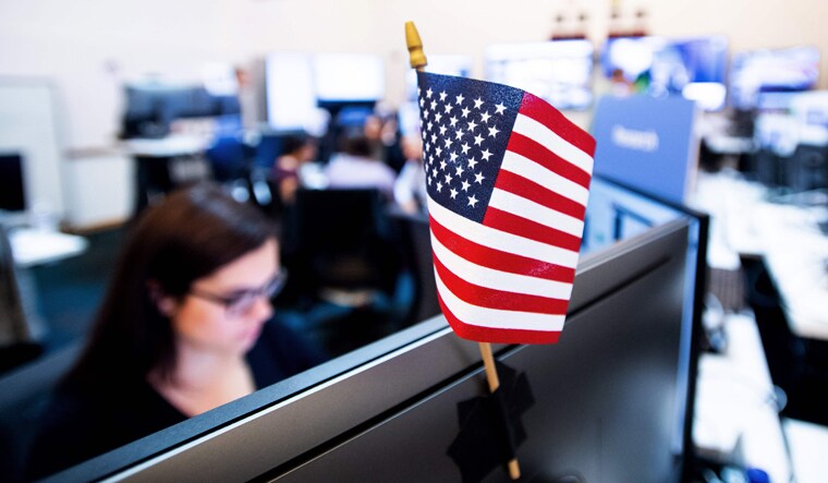 Employees work in Facebook's "War Room," during a media demonstration in Menlo Park, California | AFP