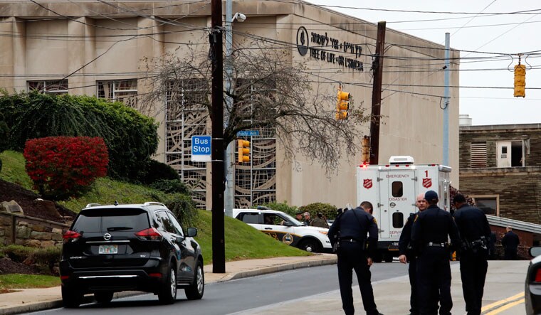 First responders stand outside the Tree of Life Synagogue in Pittsburgh after the shooting | AP