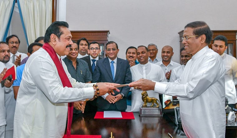 Sri Lanka's former President Mahinda Rajapaksa sworn in as the new Prime Minister before President Maithripala Sirisena in Colombo, Sri Lanka on October 26, 2018 | Reuters