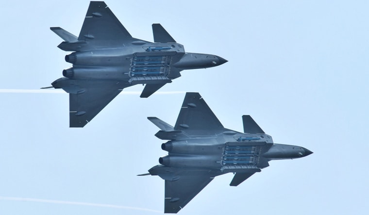Two J-20 fighters with their weapon bays open at the Zhuhai Airshow | Reuters