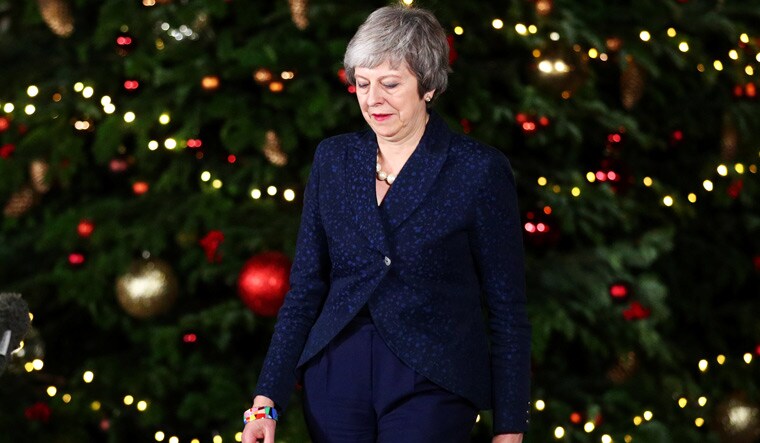 British Prime Minister Theresa May preparing to speak outside 10 Downing Street after winning the Conservative Party confidence vote | Reuters