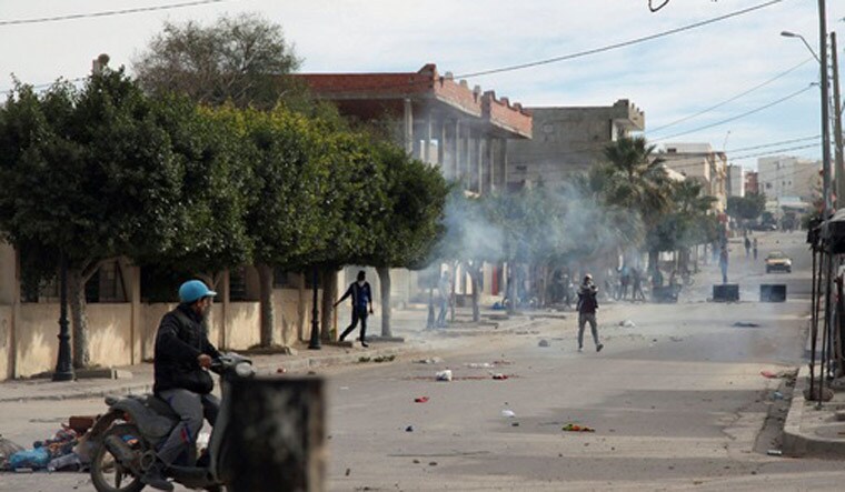Tunisian protesters throw rocks at policemen during a demonstration on December 25, 2018 in the central Tunisian city of Kasserine | PTI