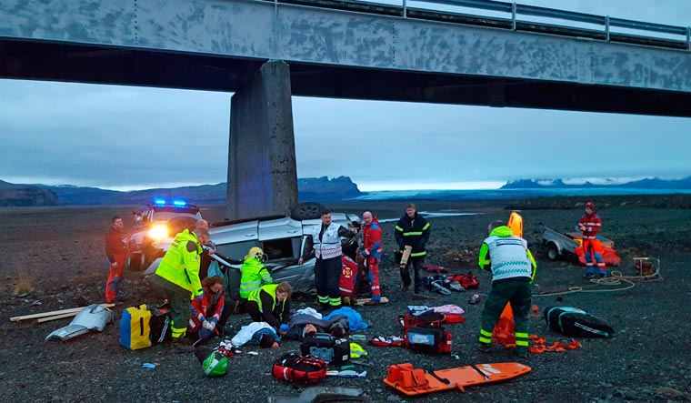 This UGC provided by Tour guide Adolf Erlingsson shows view of a crash, in Skeidararsandur, Iceland where  an SUV carrying seven members of a British family plunged off a high bridge, killing three people and critically injuring the others | PTI