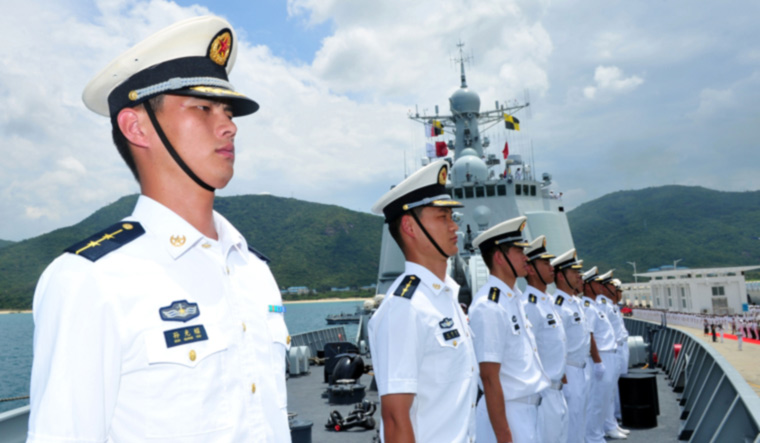 Chinese naval soldiers stand on China's missile destroyer Haikou