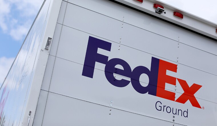 A Federal Express truck is shown on deliver in La Jola, California | Reuters