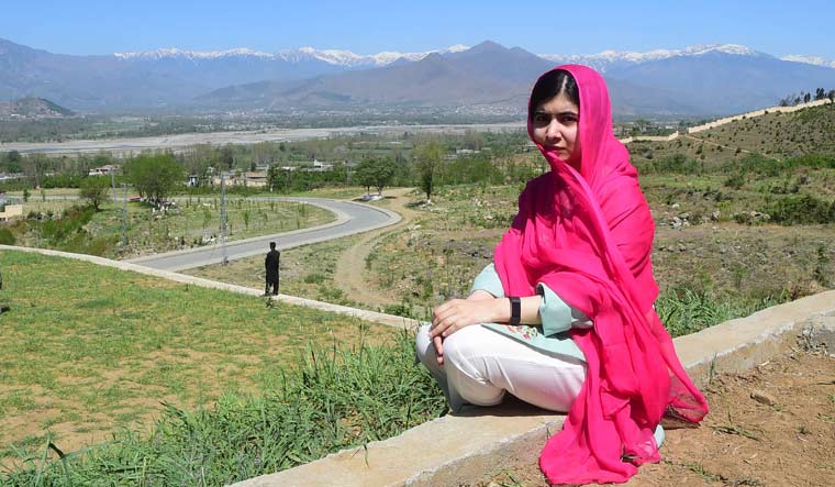 Malala Yousafzai poses for a photograph at all-boys Swat Cadet College in Guli Bagh, some 15 kilometres outside of Mingora | AFP