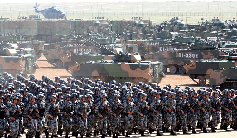  Soldiers of China's People's Liberation Army (PLA) take part in a military parade to commemorate the 90th anniversary of the foundation of the army at the Zhurihe military training base in Inner Mongolia Autonomous Region | Reuters