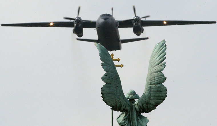 A Russian-made Hungarian air force Antonov AN-26 plane flying above the Square of Heroes in the capital Budapest | AFP