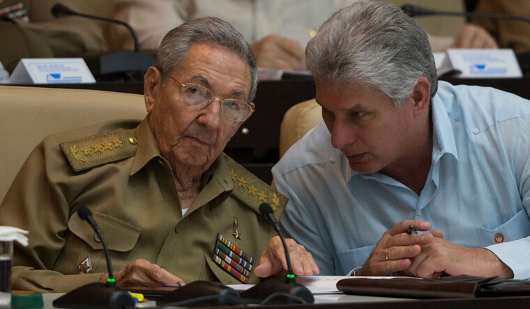Cuban President Raul Castro (L) talks with First Vice-Presidente Miguel Diaz-Canel during the First Annual Session of the Cuban Parliament at the Convention Palace in Havana | AFP