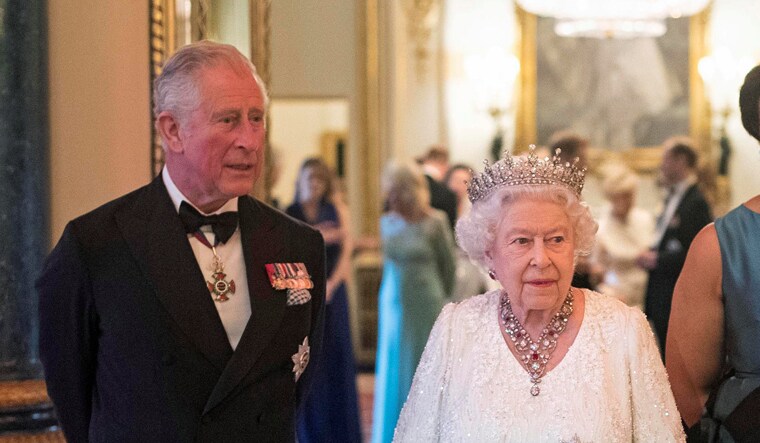 Britain's Queen Elizabeth and Prince Charles pose in the Blue Drawing Room at Buckingham Palace as the Queen hosts a dinner during the Commonwealth Heads of Government Meeting in London | Reuters