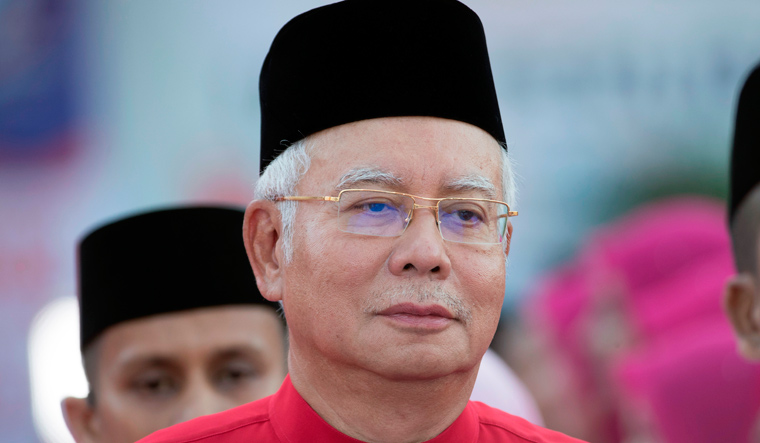 Malaysian PM dissolves parliament, two months before term ends