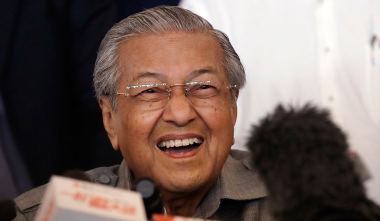 Mahathir Mohamad reacts as he speaks during a press conference in Kuala Lumpur | AP