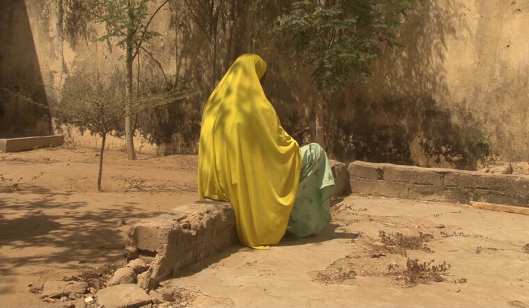 A woman who told Amnesty International that she was abused by the Nigerian army during its fight against Islamist insurgency Boko Haram is pictured in Maiduguri, Nigeria | Reuters