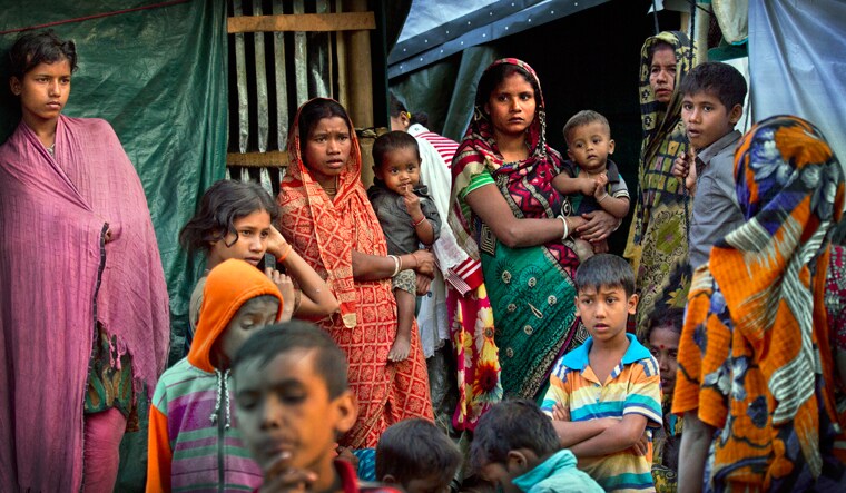 (File) Hindu refugees stand outside their make shift shelters at Kutupalong refugee camp near Cox's bazar, Bangladesh | AP