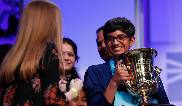 Karthik Nemmani, 14, from McKinney, Texas, holds the Scripps National Spelling Bee Championship Trophy after winning the Scripps National Spelling Bee | PTI