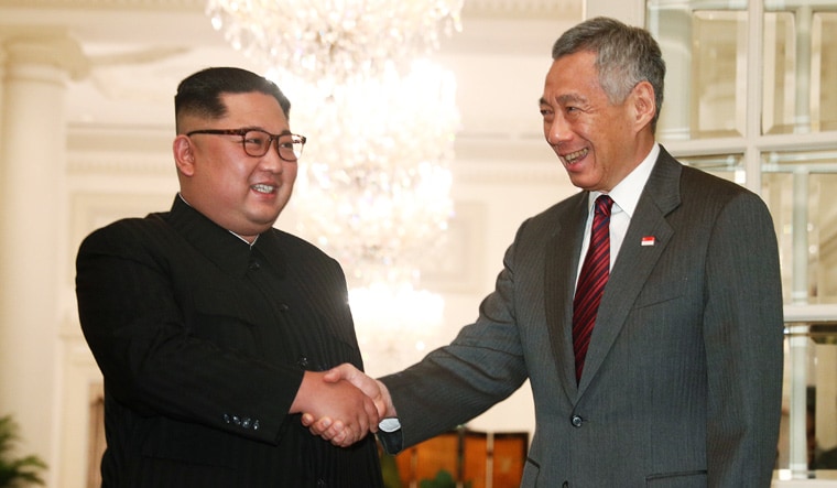 North Korea's leader Kim Jong Un shakes hands with Singapore's Prime Minister Lee Hsien Loong | Reuters
