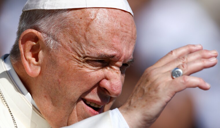 Pope Francis waves as he arrives to lead the Wednesday general audience in Saint Peter's square at the Vatican | Reuters
