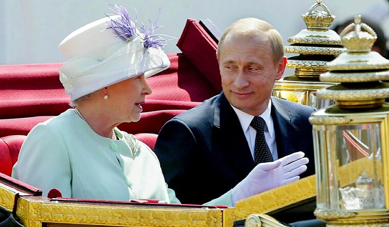(File) Russian President Vladimir Putin and Britain's Queen Elizabeth leave in an open carriage, after the president was given a ceremonial welcome on Horse Guards Parade, in London, Britain | Reuters