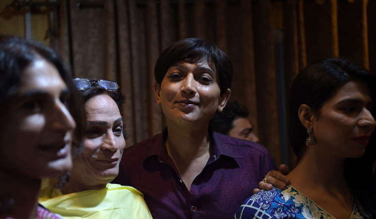Pakistani transgender independent candidate Nadeem Kashish (C), who will contest in the general elections for a parliamentary seat, is flanked by other transgender candidates after addressing a press conference at her constituency in Islamabad | AFP