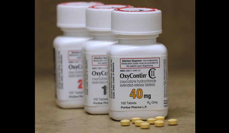 Bottles of prescription painkiller OxyContin pills, made by Purdue Pharma LP sit on a counter at a local pharmacy in Provo, Utah | Reuters