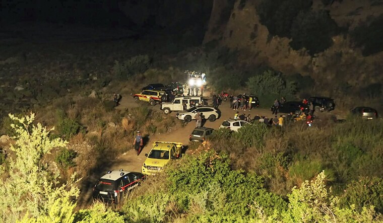 Rescuers are seen at the Raganello Gorge, a popular hiking spot in Civita, a village in the Italian Calabria southern region | AFP