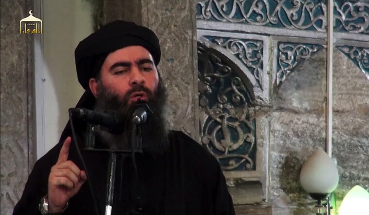 (File) Image grab from a propaganda video released on the same date by al-Furqan Media, allegedly shows the leader of the Islamic State (IS) jihadist group, Abu Bakr al-Baghdadi, aka Caliph Ibrahim, adressing Muslim worshippers at a mosque in the militant-held northern Iraqi city of Mosul | AFP