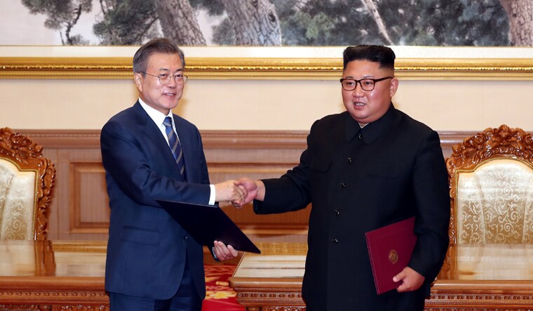 South Korean President Moon Jae-in shakes hands with North Korean leader Kim Jong Un after signing the joint statement in Pyongyang, North Korea | Reuters