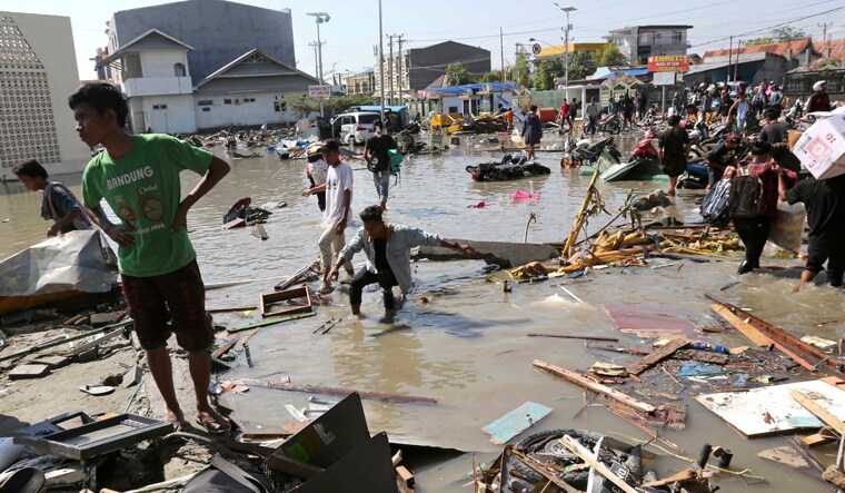 People survey the damage of the shopping mall following earthquakes and a tsunami in Palu, Central Sulawesi, Indonesia | PTI