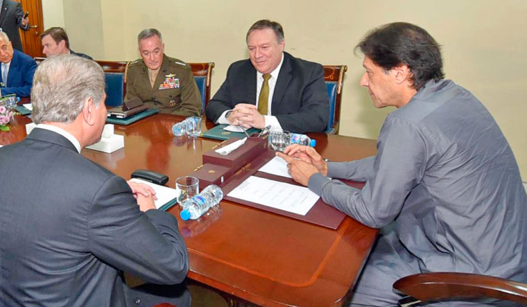 In this photo released by Press Information Department, Pakistan's Prime Minister Imran Khan, meets with US Secretary of State Mike Pompeo, in Islamabad on Wednesday