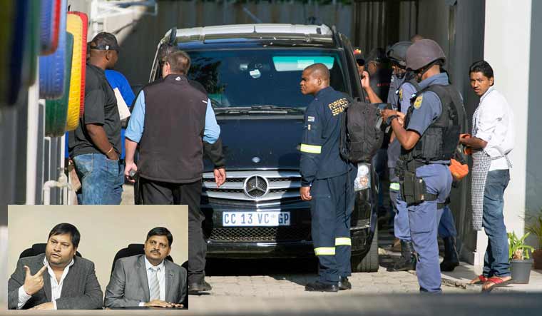 Police raid the home of the Gupta family, friends of President Jacob Zuma, in Johannesburg, South Africa| Reuters