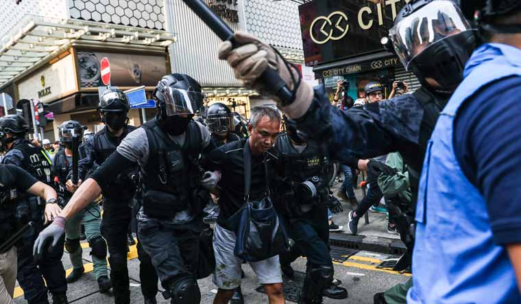 Hong Kong police make arrests as flashmob protests and clashes erupt