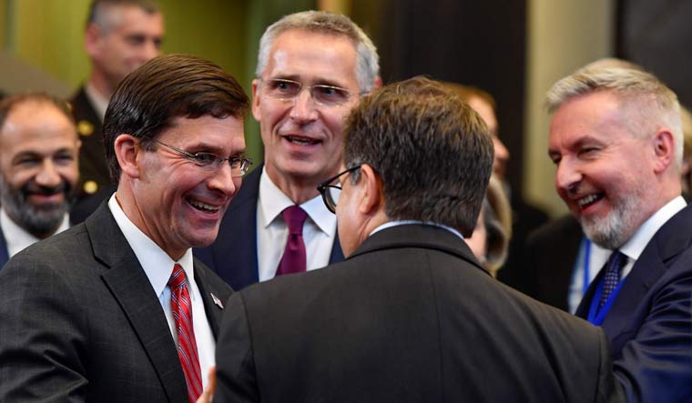 Acting US Secretary for Defense Mark Esper (L) and NATO Secretary General Jens Stoltenberg (2ndL) attend a NATO defence ministers meeting, at the NATO headquarters in Brussels | AFP