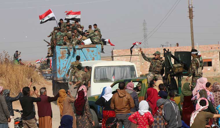 Syrian government forces reinforcements arrive near the city of Ras al-Ain | AP