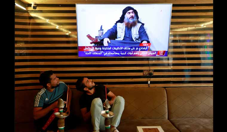 Iraqis watch TV announcing Baghdadi's death