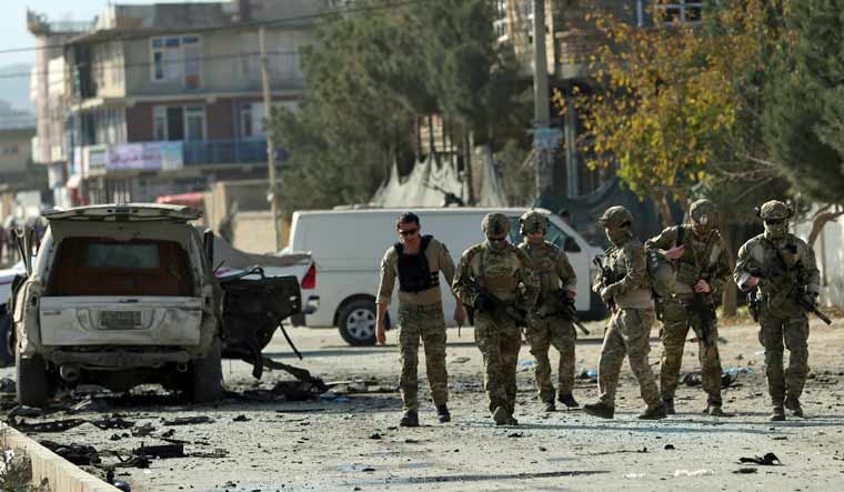 Foreign security forces gather at the site of car bomb attack in Kabul, Afghanistan | AP
