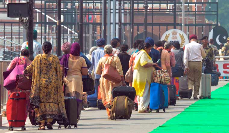 Sikh Pilgrims cross over to Pakistan, at the India-Pakistan Wagah Border Post from Amritsar on October 31, 2019, to celebrate the 550th birth anniversary of Sri Guru Nanak Dev, the founder of Sikhism, at the Nankana Sahib in Pakistan| AFP