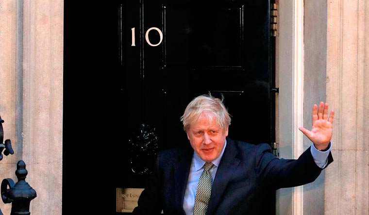 Britain's Prime Minister Boris Johnson delivers a speech outside 10 Downing Street in central London | AFP