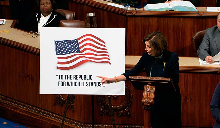House Speaker Nancy Pelosi of Calif., points to a poster as she speaks as the House of Representatives debates the articles of impeachment against President Donald Trump at the Capitol in Washington, Wednesday, Dec. 18, 2019 | AP