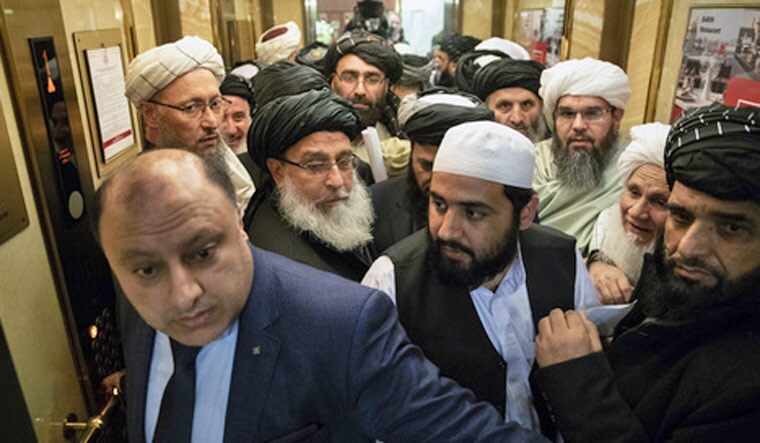 Taliban officials gets into an elevator as they attends the "intra-Afghan" talks in Moscow, Russia 