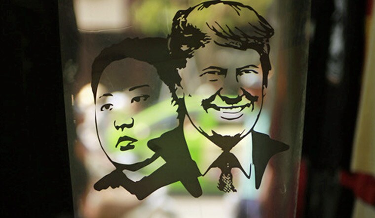 A print design with portraits of US President Donald Trump, right, and North Korean leader Kim Jong Un, at a custom t-shirt shop in Hanoi, Vietnam | AP