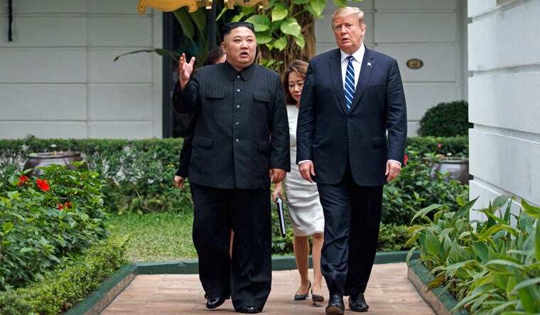 President Donald Trump and North Korean leader Kim Jong Un take a walk at the Sofitel Legend Metropole Hanoi hotel | AP