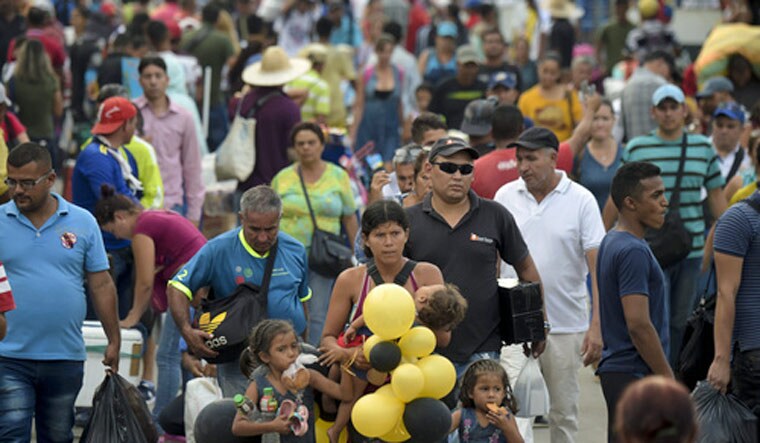 People cross the Simon Bolivar International Bridge on the border between Tachira in Venezuela and Cucuta in Colombia | PTI