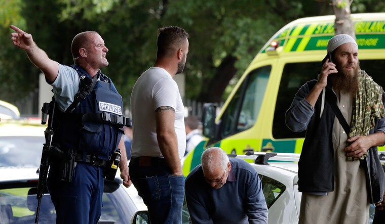 Policemen outside one of the mosques targeted by gunmen in Christchurch | AP
